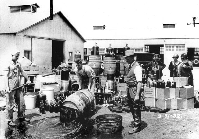 640px-Orange_County_Sheriff's_deputies_dumping_illegal_booze,_Santa_Ana,_3-31-1932.jpg